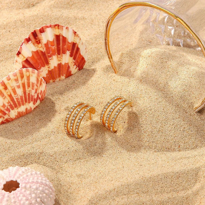 Gold - plated stainless steel spiral drop earrings - AMVIM