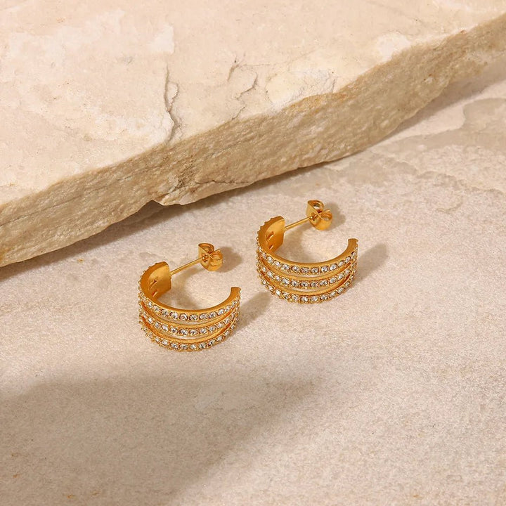 Gold - plated stainless steel spiral drop earrings - AMVIM